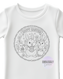 White t-shirt with Easter-themed design featuring bunnies and flowers on a white background.